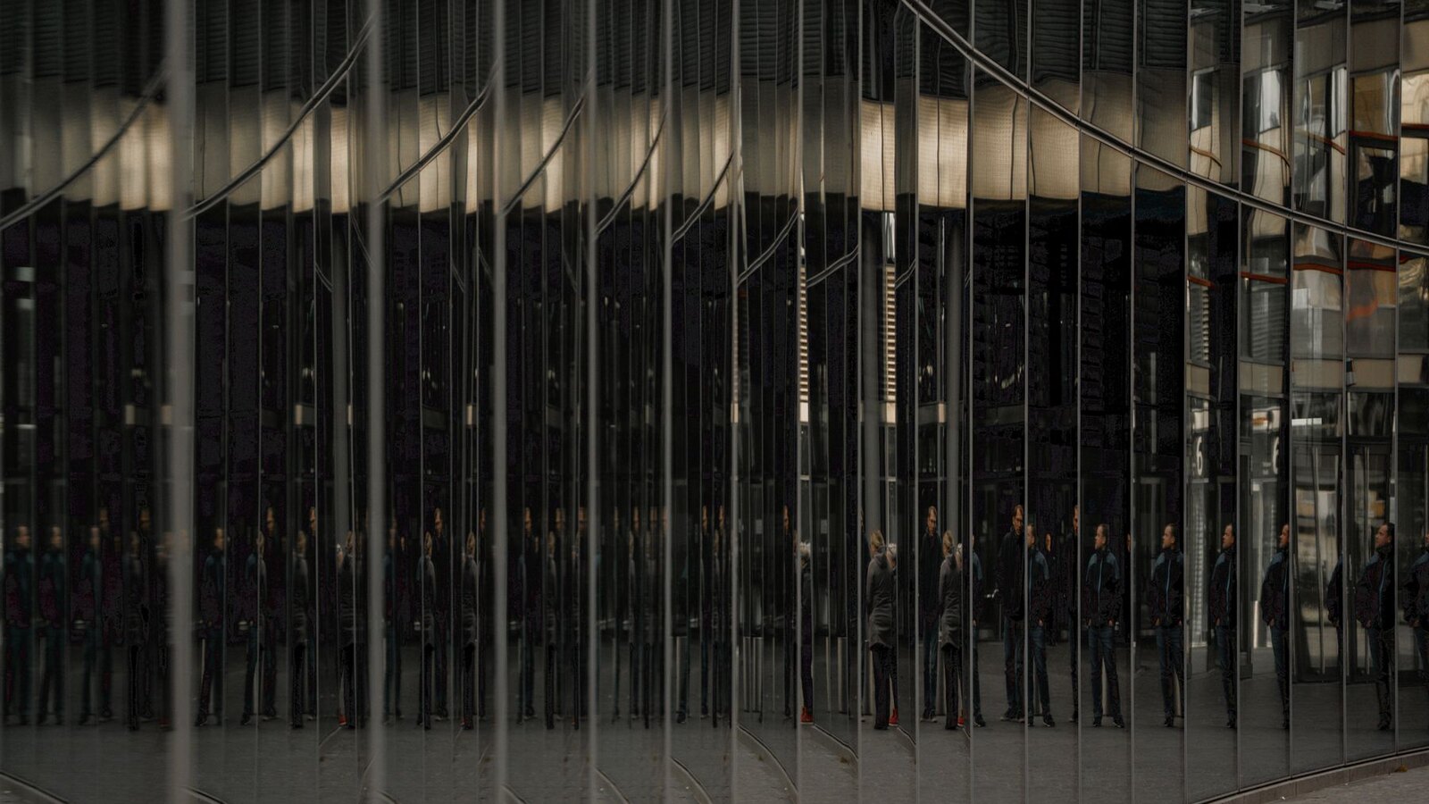 Mirrored glass architecture representing two family office AI deployment models